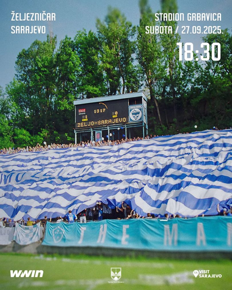 Navijači Željezničara sa velikom zastavom na stadionu tokom utakmice