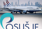 Croatia Airlines Airbus A320 avion na pisti s Dubajem u pozadini