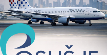 Croatia Airlines Airbus A320 avion na pisti s Dubajem u pozadini