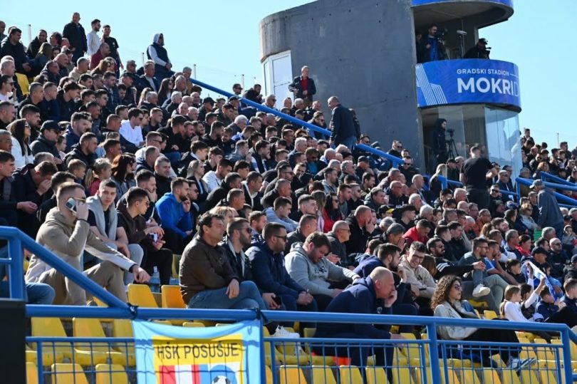 Gpacked stadium stands with Posušje fans cheering during the match against Zrinjski